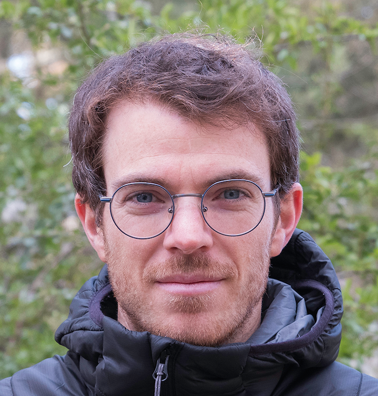 Physics based multi-scale constitutive modeling of granular materials